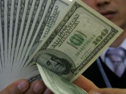 En casas de cambio de la frontera norte, el dólar alcanzó un precio de 14.30 pesos. ARCHIVO  /