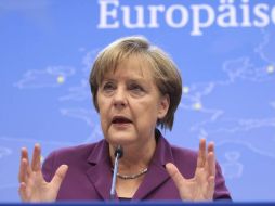 Según el diario estadounidense, Merkel dio un mensaje muy claro sobre la renuncia de Berlusconi en la llamada con Napolitano. ARCHIVO  /