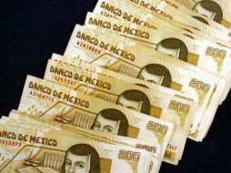 En el mercado de divisas el peso prácticamente no presentó cambio al nivel observado durante el inicio de sesión. ARCHIVO  /