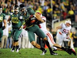Lavasier Tuinei atrapó ocho pases para 158 yardas y dos touchdowns. AFP  /