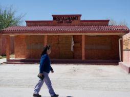 Al paso de grupos del crimen organizado, algunas localidades van quedando desiertas por el escape de los pobladores.  AFP-Archivo  /