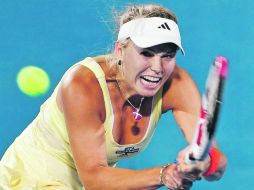 La tenista número uno del mundo,Caroline Wozniacki, tuvo ayer su último partido antes de jugar el Abierto de Australia. REUTERS  /