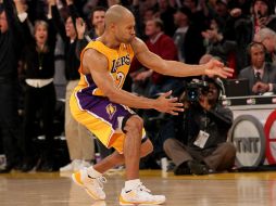 El número 2, Fisher, celebra luego de anotar los tres puntos ganadores. AFP  /