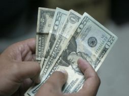 En Nuevo Laredo se ubicó la cotización mínima a la compra de 12.70 pesos. ARCHIVO  /