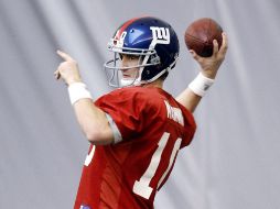 Eli Manning espera repetir la victoria sore los Patriotas en el Super Bowl. AP  /