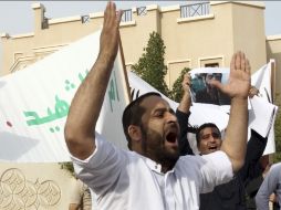 Alrededor del mundo hay manifestaciones para exigir el alto a la violencia. En la foto, protesta frente a la embajada rusa en Qatar. AP  /