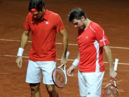 Isner dio el gran golpe al sorprender a Federer en cuatro mangas, por 4-6, 6-3, 7-6 (74) y 6-2. AFP  /