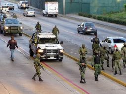 Las 26 víctimas fueron encontradas en vehículos en Los Arcos del Milenio, el 24 de noviembre de 2011. ARCHIVO  /