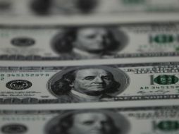 El cierre a la alza de la moneda estadounidense fue de 12.99 pesos. ARCHIVO  /