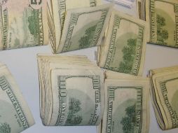 Casas cambiarias de Guadalajara, compraron el billete en 12.60 pesos, y lo vendieron 12.90 pesos. ARCHIVO  /