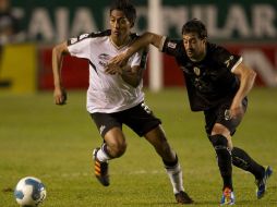 Facundo Pereyra (Derecha) de San Luis y Hugo Rodríguez (Izquierda) de Atlas. MEXSPORT  /