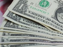 El mínimo a la compra registrado durante la jornada fue de 11.95 pesos. ARCHIVO  /