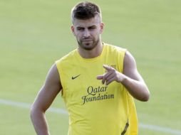 El defensa Gerard Piqué ha dejado atrás sus molestias musculares y podrá disputar el partido de mañana. REUTERS  /