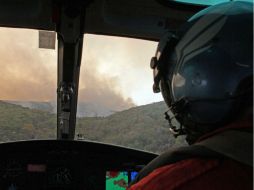 El incendio lleva más de 60 horas, y han sido afectadas 300 mil 300 hectáreas. NTX  /