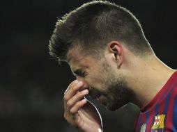 Piqué pudo reincorporarse al juego, pero 10 minutos más tarde tuvo que solicitar el cambio. AFP  /