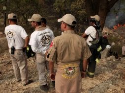 Elementos de corporaciones policiacas realizan rondines después de las intimidaciones que padecieron brigadistas. ARCHIVO  /