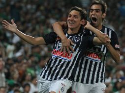 Nery Cardozo (izq) anotó el gol que le dio el pase al Mundial de Clubes al Monterrey, aquí celebra con Delgado. MEXSPORT  /