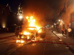 Se acusa a los jóvenes de haber quemado una patrulla de la Policía estatal y un taxi la noche del viernes. REUTERS  /