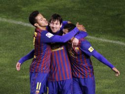 La estrella azulgrana (c) marcó dos goles y participó activamente en casi todos los demás. REUTERS  /