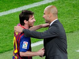 Messi y Guardiola celebran tras un gol del argentino en un juego la semana pasada. ARCHIVO  /