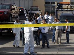 En dos camionetas abandonadas en Ixtlahuacán fueron hallados restos de 15 personas. EFE  /