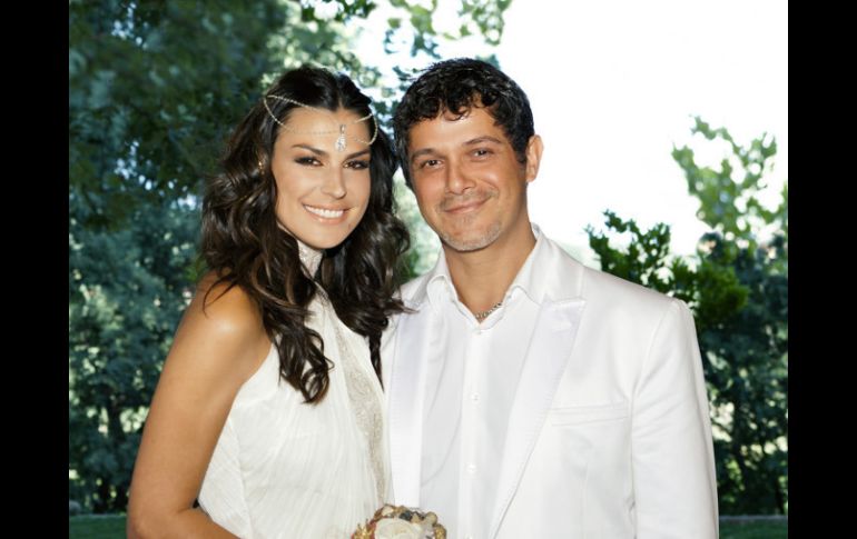 La sorpresa para quienes asistían al bautismo del hijo de Sanz y Perera: también asistieron a la boda. AP  /