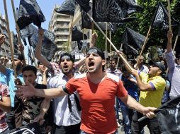 Seguidores del movimiento islámico Hizb al-Tahrir protestan contra el régimen de Siria y condenan la masacre de Hula. EFE  /