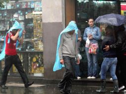 La Conagua informa que continuarán nublados con lluvias moderadas a fuertes y actividad eléctrica. ARCHIVO  /