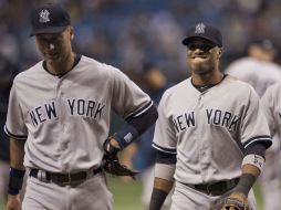 Derek Jeter y Robinson Canó sonríen tras romper maldición contra Tampa Bay. REUTERS  /