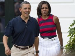 El presidente Barack Obama, llega junto con su esposa, Michelle, a los festejos por el Día de la Inependencia. AFP  /