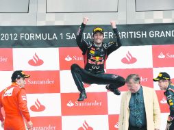 Australiano feliz. Mark Webber, tras ganar en Mónaco, se llevó la bandera a cuadros en Silverstone. AFP  /