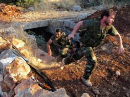 Combatientes en Siria. El Consejo de Seguridad de la ONU considera un proyecto que amaga a Siria con sanciones. REUTERS  /