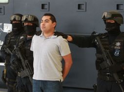 Luis Cárdenas Palomino reiteró que el detenido (c) estaba coludido con el crimen organizado. NOTIMEX  /