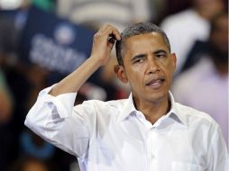 Barack Obama es criticado por sus rivales electorales de ''dividir'' y ''distraer'' al país por sus acusaciones contra Romney. AP  /