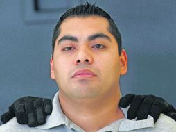 El ex agente permanecerá detenido para deslindar responsabilidades por su participación en el ataque. AP  /