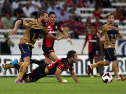 Los Rojinegros debutaron con empate ante Pumas, gracias a un autogol. NTX  /