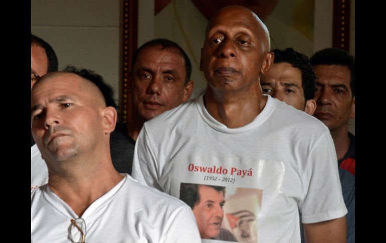 El opositor vestía una camiseta con el rostró de Oswaldo Payá al momento de la detención. AFP  /