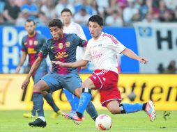 Titular. El mediocampista Jonathan dos Santos (izq.) jugó los primeros 45 minutos del partido de preparación. EFE  /