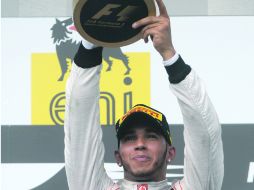Vuelve al podio. Lewis Hamilton logra su tercer triunfo en Hungría. AFP  /