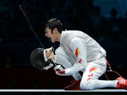 Sheng celebra su victoria al terminar el encuentro. AFP  /