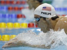 Phelps alcanzó la cumbre de su medallero en la posta de 4x200 metros estilo libre. AP  /