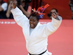 La caribeña celebra su primer campeonato olímpico en Londres 2012. XINHUA  /