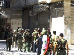 Soldados sirios desplegados en la zona de Yalda, a unos 10 kilómetros al sur de Damasco. EFE  /