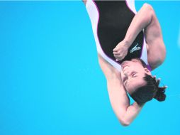 Trampolín de tres metros. Laura Sánchez ejecuta uno de sus saltos durante la final disputada en el Centro Acuático de Londres. AFP  /