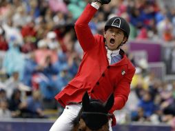 Montando a ''Rosalía La Silla'', Michán finaliza en el puesto 22 de la tercera ronda clasificatoria y luchará por medallas. AP  /