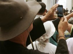 La aplicación permitirá a los interesados seguir los eventos y discursos en directo, ver y compartir fotografías y videos. ARCHIVO  /