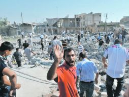 El ataque de la aviación siria con misiles fue devastador en una zona de Azaz, distrito de Alepo. AFP  /