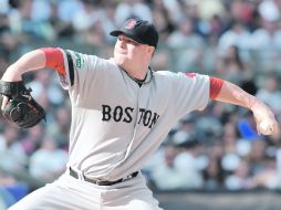 El lanzador de los Medias Rojas, Jon Lester, trabajó siete rollos completos, permitió cinco imparables y sólo una carrera limpia. AFP  /
