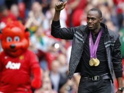Es bien sabida la afición de Bolt por el equipo dirigido por Ferguson. REUTERS  /