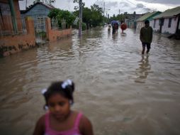 Las calles haitianas se encuentran bajo el agua, no hay energía eléctrica y las vías de comunicación están afectadas. AP  /